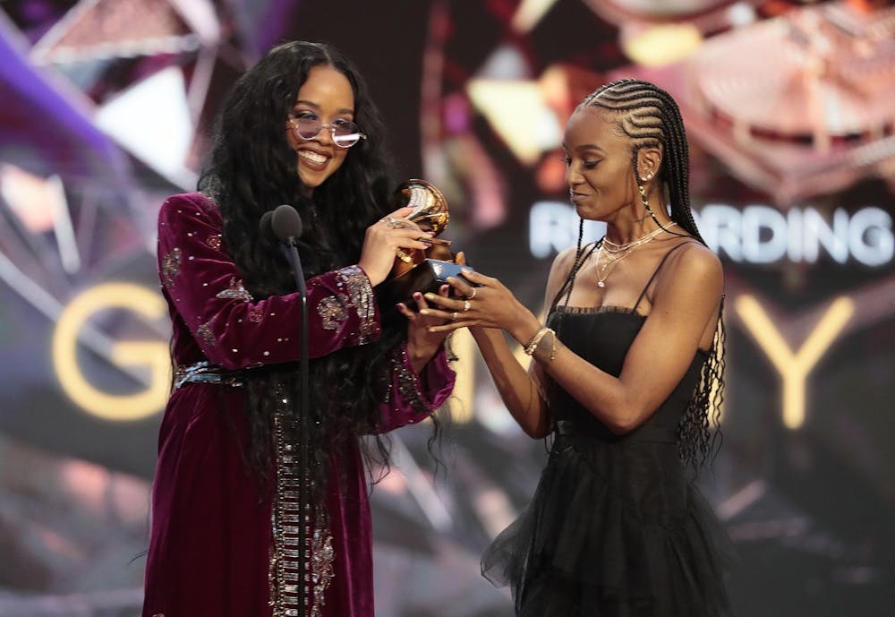 Los Angeles, CA, Sunday, March 14, 2021 - H.E.R. and Tiara Thomas accepts the award for Song Of The Year at the 63rd Grammy Award outside Staples Center. Photo courtesy of Robert Gauthier/Los Angeles Times.