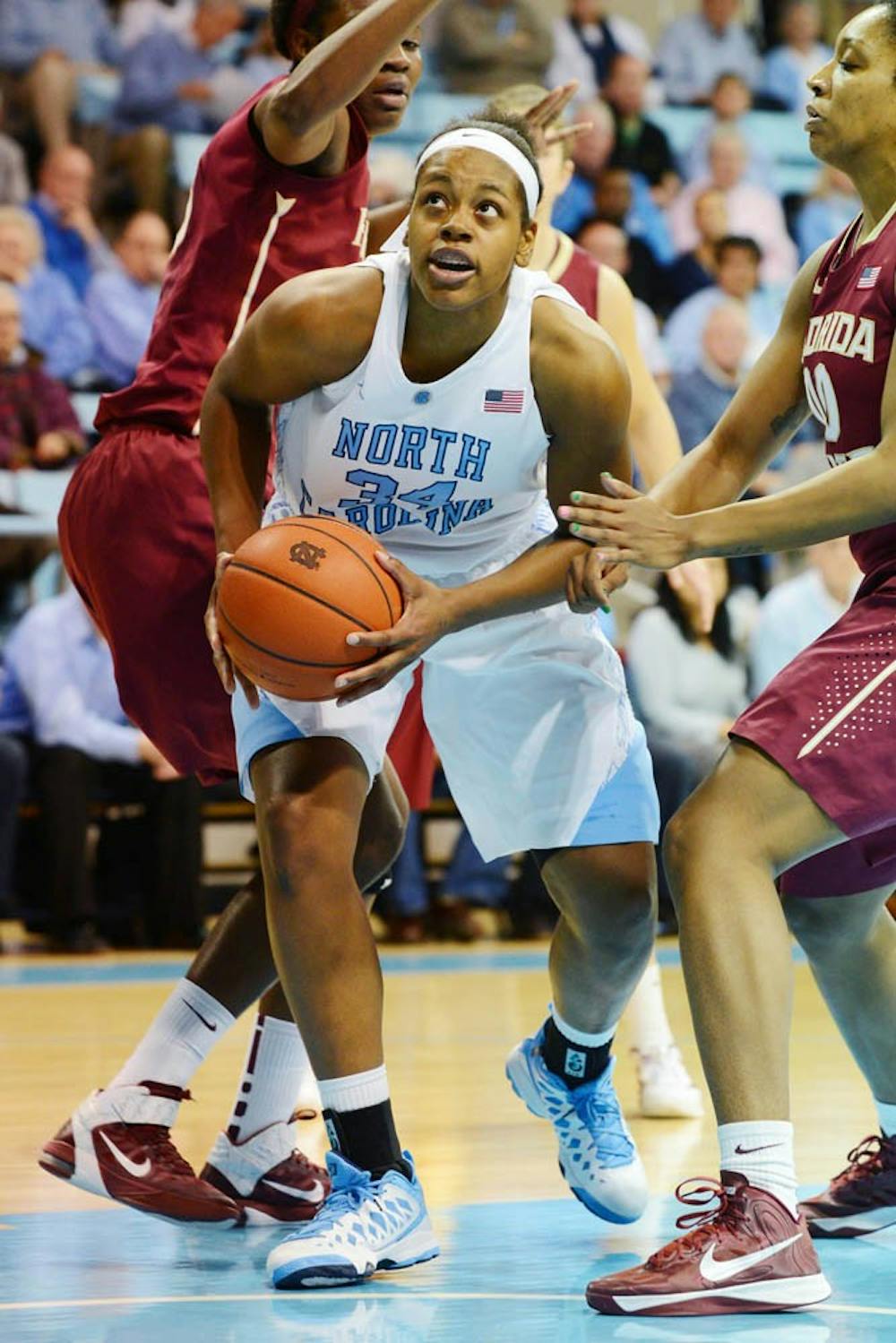 UNC Forward Xylina McDaniel (34) drives to the hoop in the first half. 