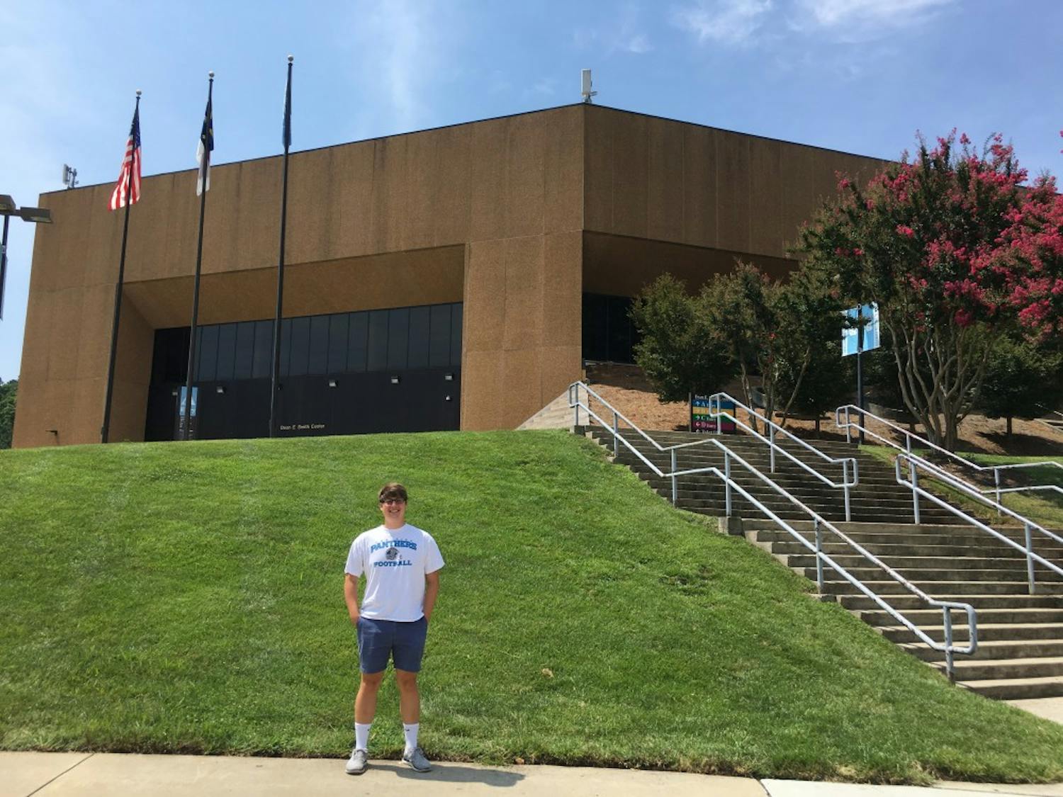 Sophomore journalism major David Brewer stands in front of the Smith Center. 