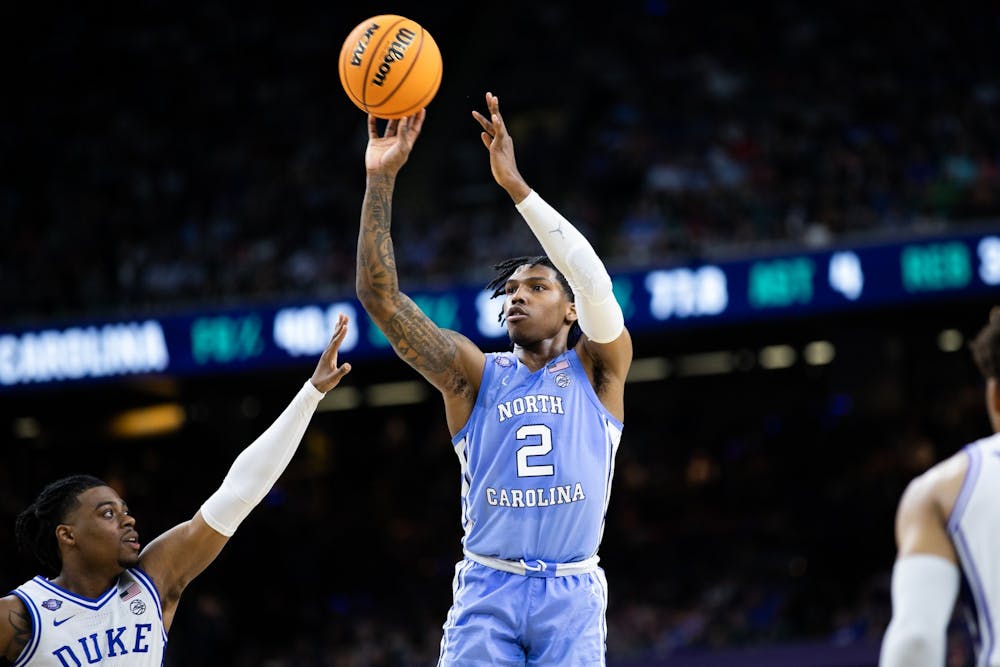 <p>UNC sophomore guard Caleb Love (2) goes up for a three-pointer during the final minutes of the Final Four of the NCAA Tournament against Duke in New Orleans on Saturday, April 2, 2022. UNC won 81-77.</p>