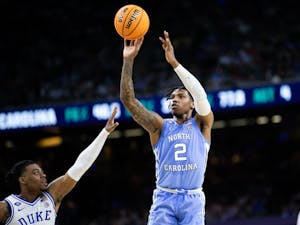 UNC sophomore guard Caleb Love (2) goes up for a three-pointer during the final minutes of the Final Four of the NCAA Tournament against Duke in New Orleans on Saturday, April 2, 2022. UNC won 81-77.