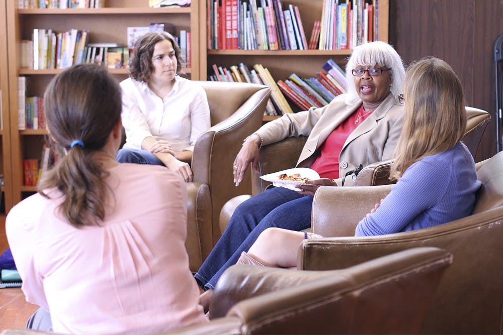 From back to front: Katie Cartwell, Margie Scott, Heather Socha and Kristen Lewis discuss "The Roundhouse" by Louise Erdrich during an Employee Forum book club discussion in Bulls Head Book Shop on Friday.