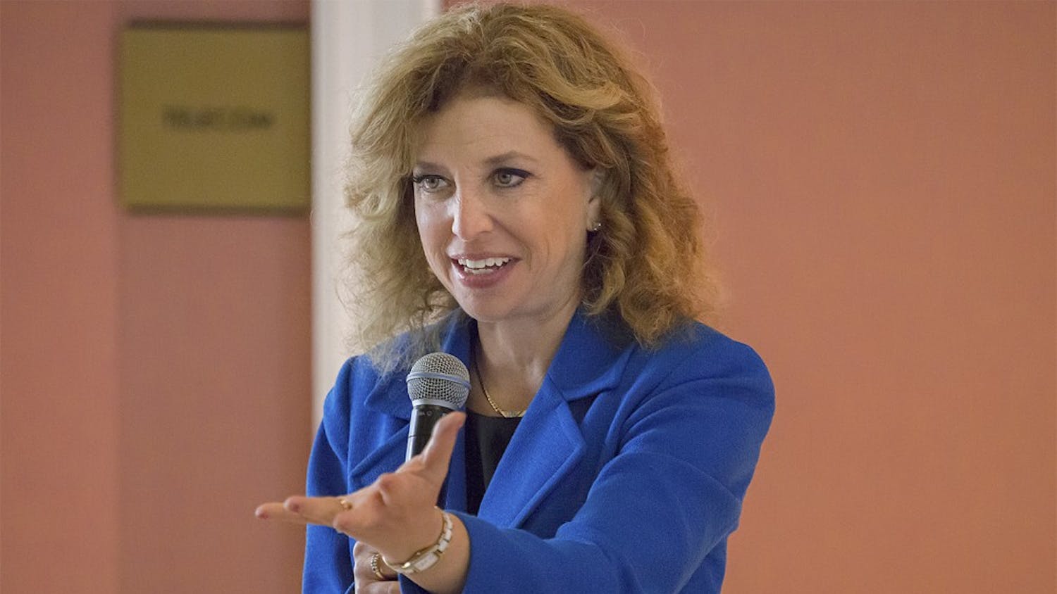 Rep. Debbie Wasserman Schultz (D-FL), chairwoman of the Democratic National Committee, encourages UNC students, who gathered to hear her speak in Gerrard Hall Monday, to re-elect Sen. Kay Hagan in next month's midterm elections.