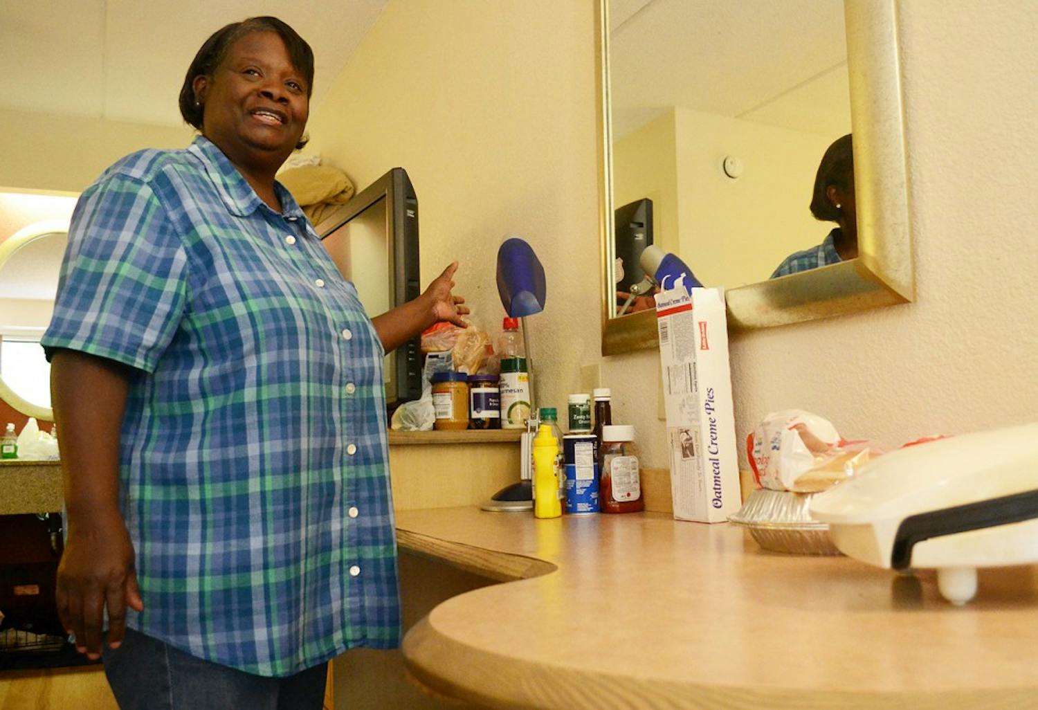 After being evicted from Collins Crossing, Sula Eubanks moved to Red Roof Inn with her husband, daughter. and two chihauhaus. They have learned to make do with fewer immenties by cooking on a George Forman Grill and keeping perishable food iced in the sink. 