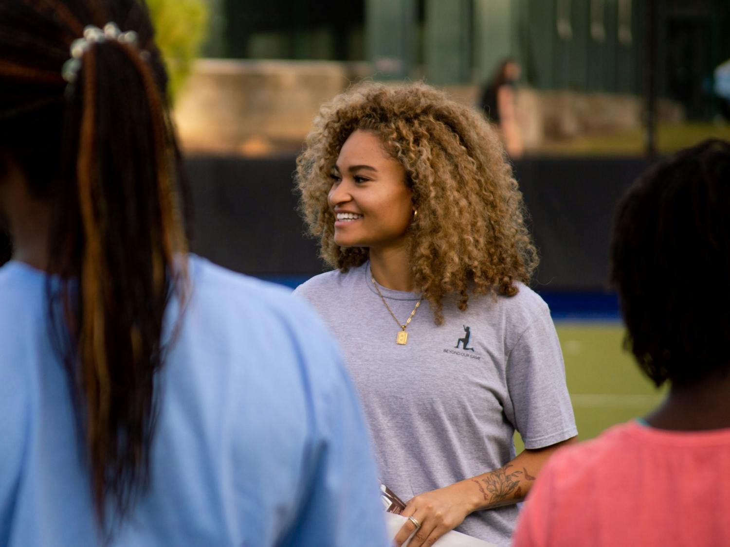 Courtnie Williamson, a former UNC Field HOckey player and organizer of the event, speaks at the "Evenin' Out The Playing Field" event on Saturday, Nov. 5, 2022.