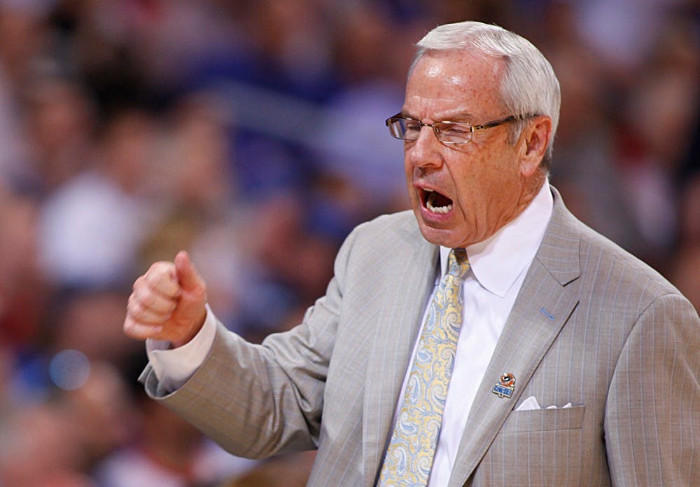 UNC head coach Roy Williams gets fired up during the game.
