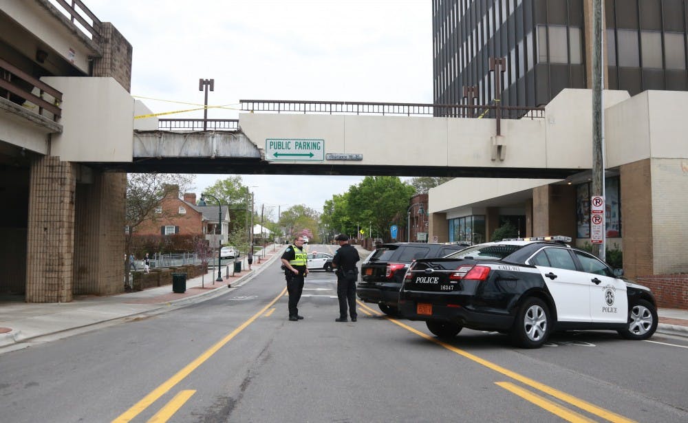 The bridge over East Rosemary that connects the CVS building and the Bank of America Parking Deck collapsed Sunday afternoon. 