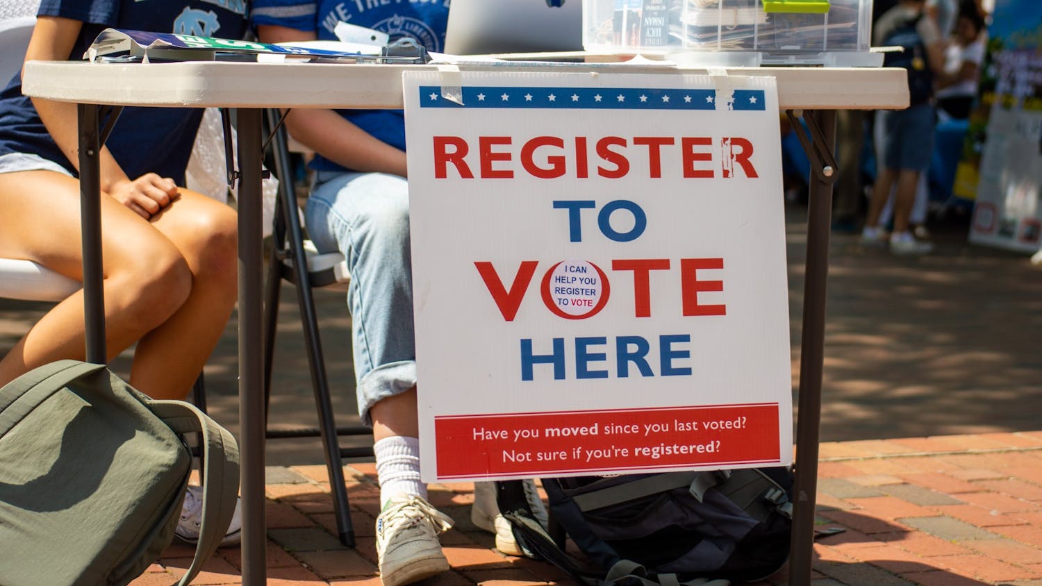 Students table in the pit, offering to register voters on Sept. 15, 2022.