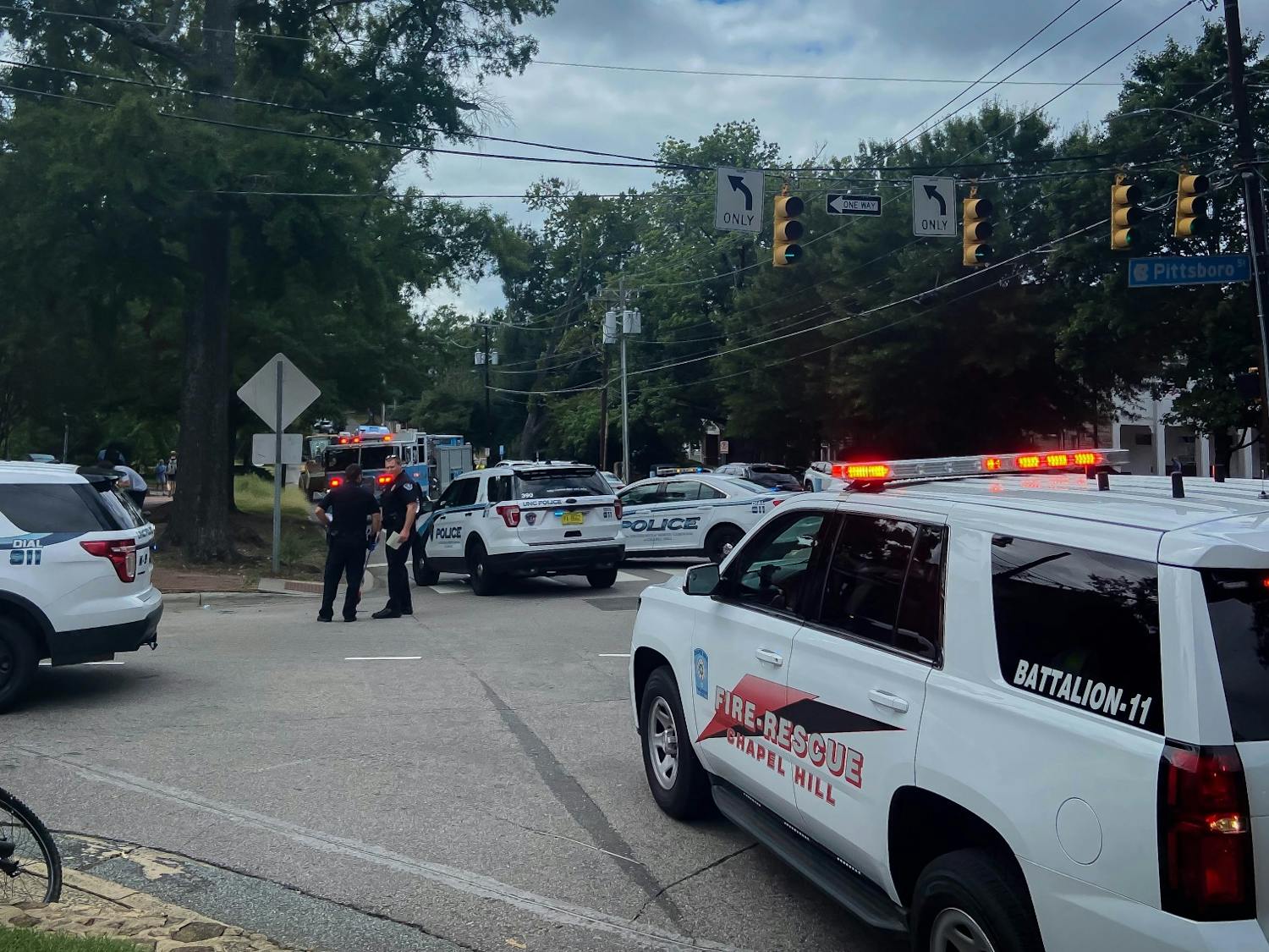 Chapel Hill Fire Rescue and UNC Police gather at the intersection of Pittsboro St and W Cameron Ave on Thursday, Sept. 8, 2022.