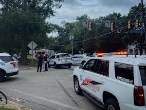 Chapel Hill Fire Rescue and UNC Police gather at the intersection of Pittsboro St and W Cameron Ave on Thursday, Sept. 8, 2022.