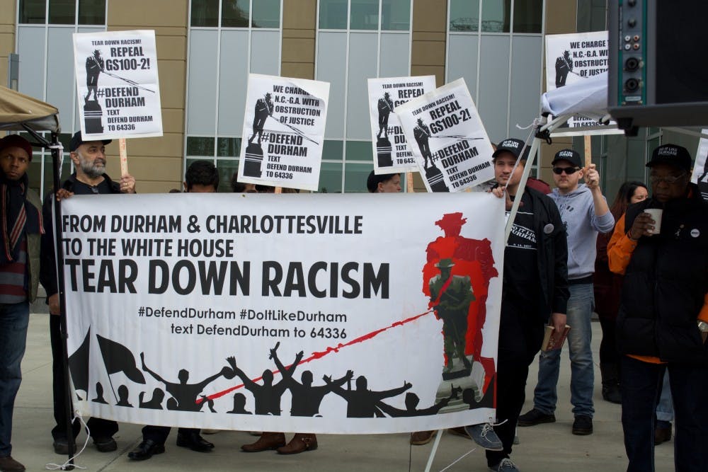 <p>Protesters from Defend Durham, a local activist organization, demonstrated outside the county courthouse as protesters awaited their verdicts Dec. 5. The demonstration included speeches, as well as a sketching station for people to facilitate replacement statue ideas. &nbsp;</p>
