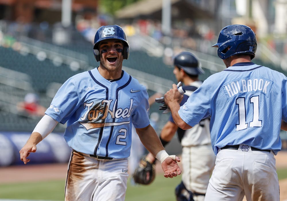 North Carolina's Mikey Madej (2) celebrates scoring against Notre Dame in the semifinals of the 2022 ACC Baseball Championship in Charlotte, N.C., Saturday, May 28, 2022. Photo courtesy of Nell Redmond/ACC Media.