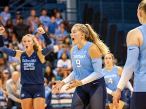 UNC sophomore outside hitter Mabrey Shaffmaster (9) celebrates getting a point during volleyball match against Michigan on Saturday, Sept. 10, 2022, at Carmichael Arena. Michigan beat UNC 3-0.