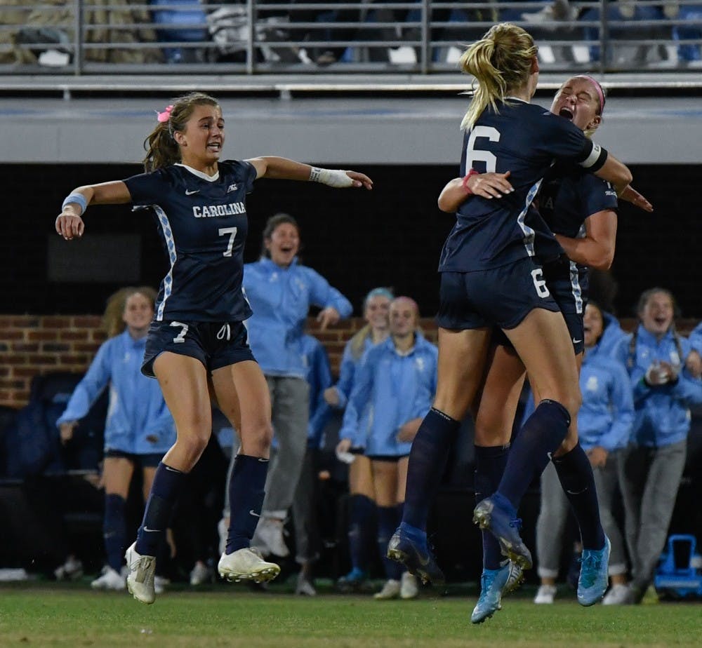 Taylor Otto (6) and Julia Dorsey (7) celebrate Alessia Russo's (19) goal that  led to North Carolina defeating Colorado 1-0 at Dorrance Field in the second round of the NCAA Women's soccer tournament.