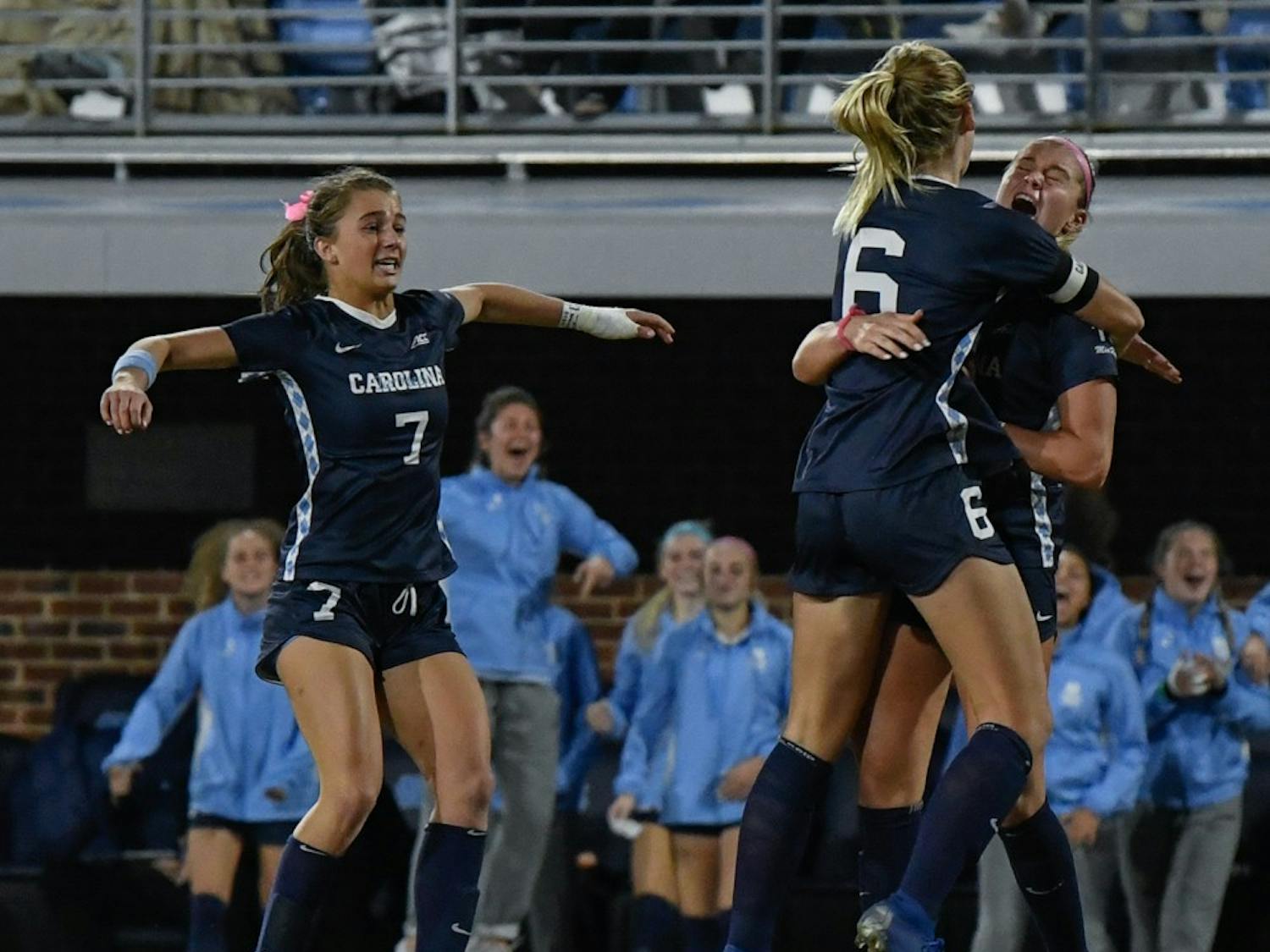 Taylor Otto (6) and Julia Dorsey (7) celebrate Alessia Russo's (19) goal that  led to North Carolina defeating Colorado 1-0 at Dorrance Field in the second round of the NCAA Women's soccer tournament.