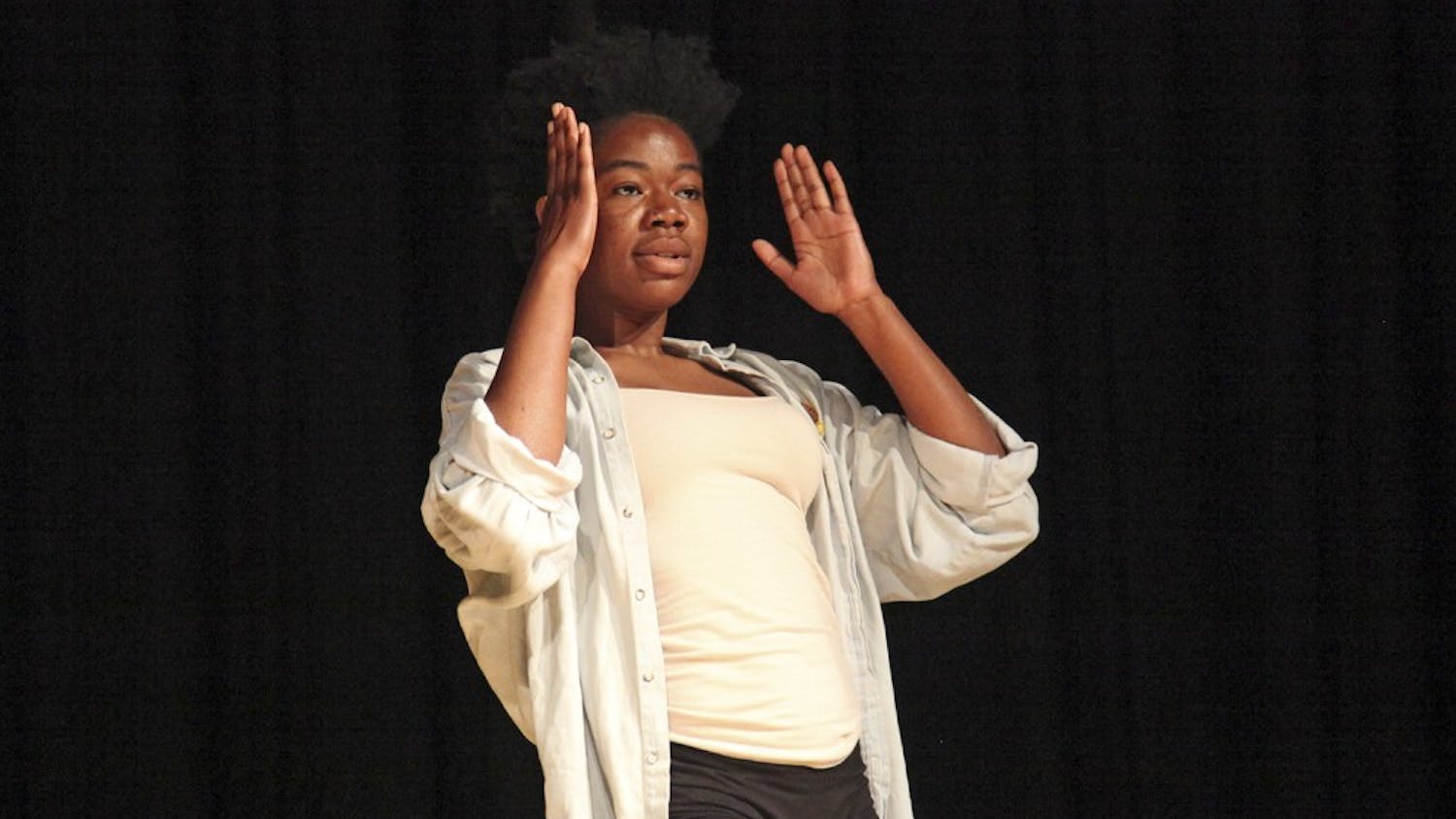 Damola Akintunde performs the opening dance during the Body Politics talk in in the Sonya B. Hayes Stone Center on Wednesday night.