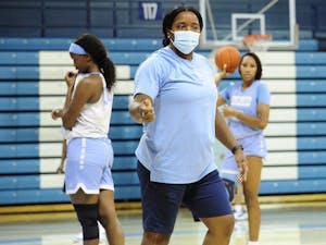 UNC women's basketball coach Joanne Aluka-White coaches at a preseason practice in Carmichael Arena, September 16, 2020. Photo courtesy of Dana Gentry/UNC Athletic Communications.