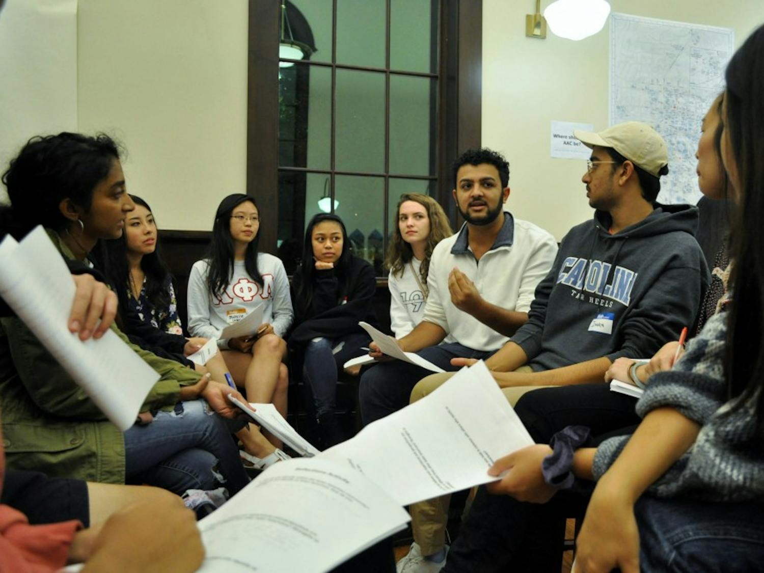 Students participate in a reflection activity during an open forum hosted by the Asian American Center Student Advisory Board at Campus Y's Anne Queen Lounge on Thursday, Oct. 24, 2019. The forum gave attendees the chance to learn about the movement to establish an Asian American Center on campus.