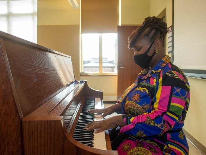 Dr. LaSaundra Booth plays piano in the piano lab at Kenan Music Building on Tuesday, Mar. 8, 2022. Dr. Booth was recently featured as the NAfME 2021 All-National Honors Orchestra Conductor.
