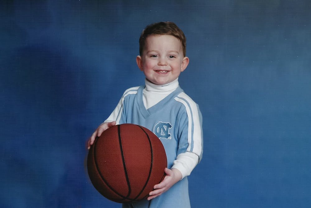 <p>A young Ethan E. Horton poses in his UNC gear during a photo shoot in 2004.<br>
Photo Courtesy of Marion Horton.</p>