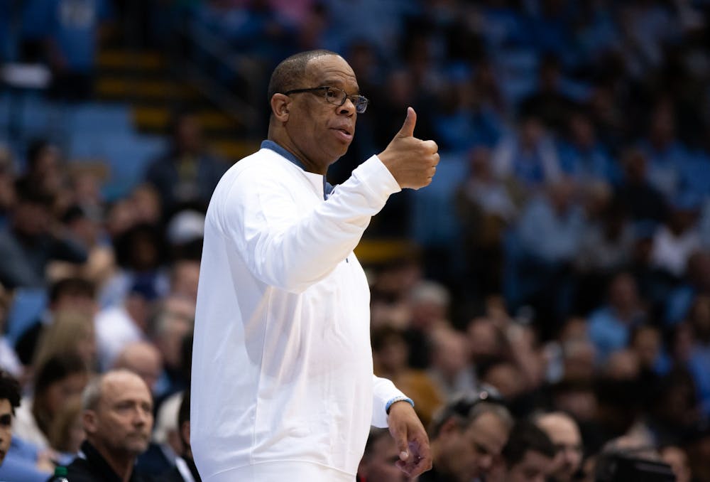 UNC head coach, Hubert Davis, gestures to his players in the Dean Smith Center on Jan. 4, 2023, against the Wake Forest Deamon Deacons.