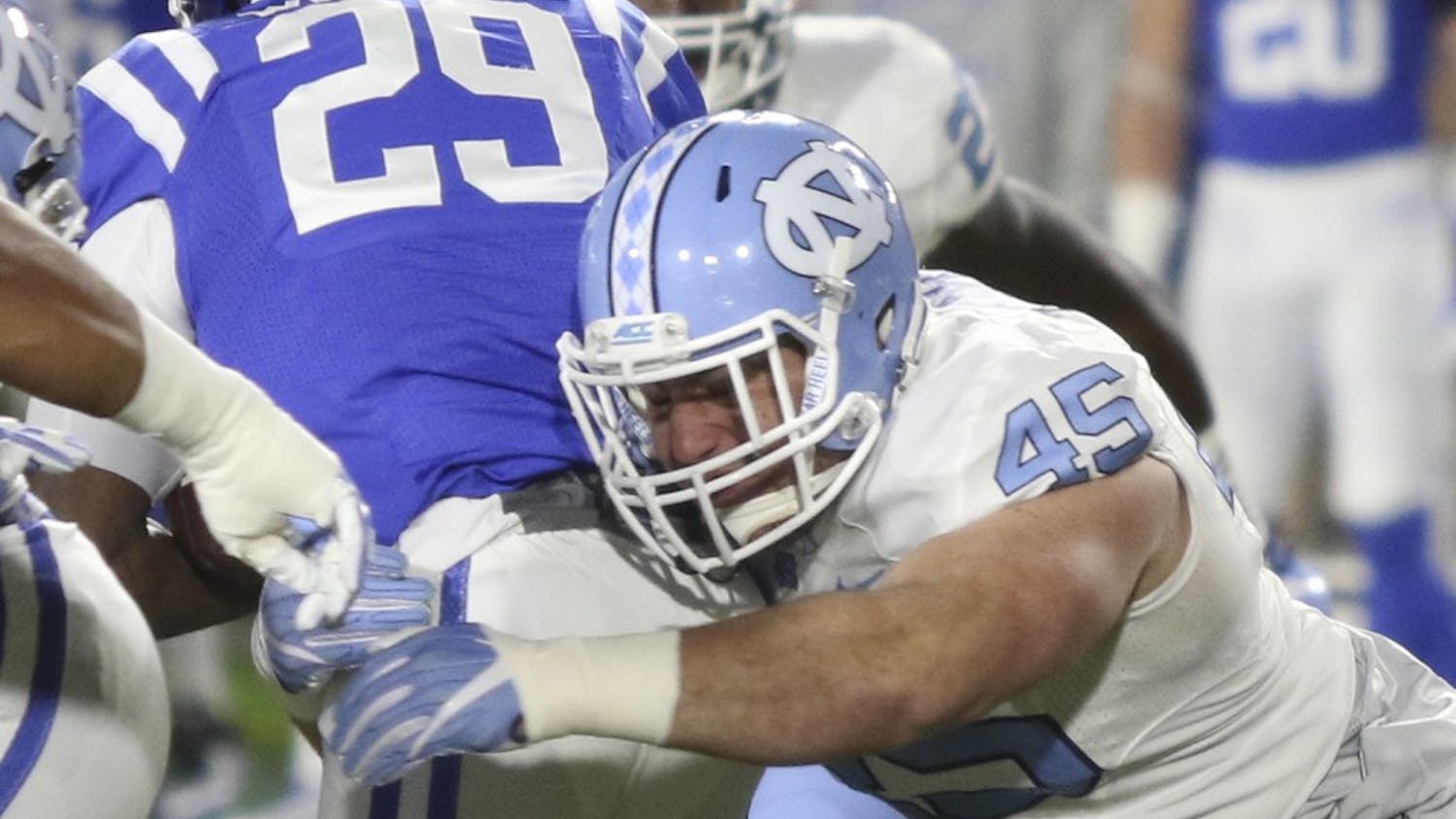 UNC defensive end Mikey Bart (45) makes a tackle against Duke in Durham last Thursday.