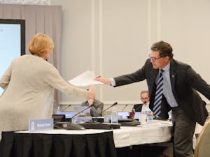 Mimi Chapman, chairperson of the UNC faculty, interacts with UNC Trustee Perrin Jones on Wednesday, March 22, 2023. Chapman emphasized to the UNC Board of Trustees concerns of the faculty regarding the development of the School of Civic Life and Leadership program.
