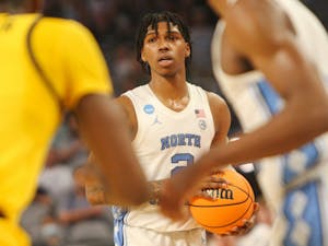 UNC sophomore guard Caleb Love (2) looks for an open pass during the first round of the NCAA tournament against Marquette on Thursday, March 17, 2022, in Fort Worth, Texas. UNC won 95-63.
