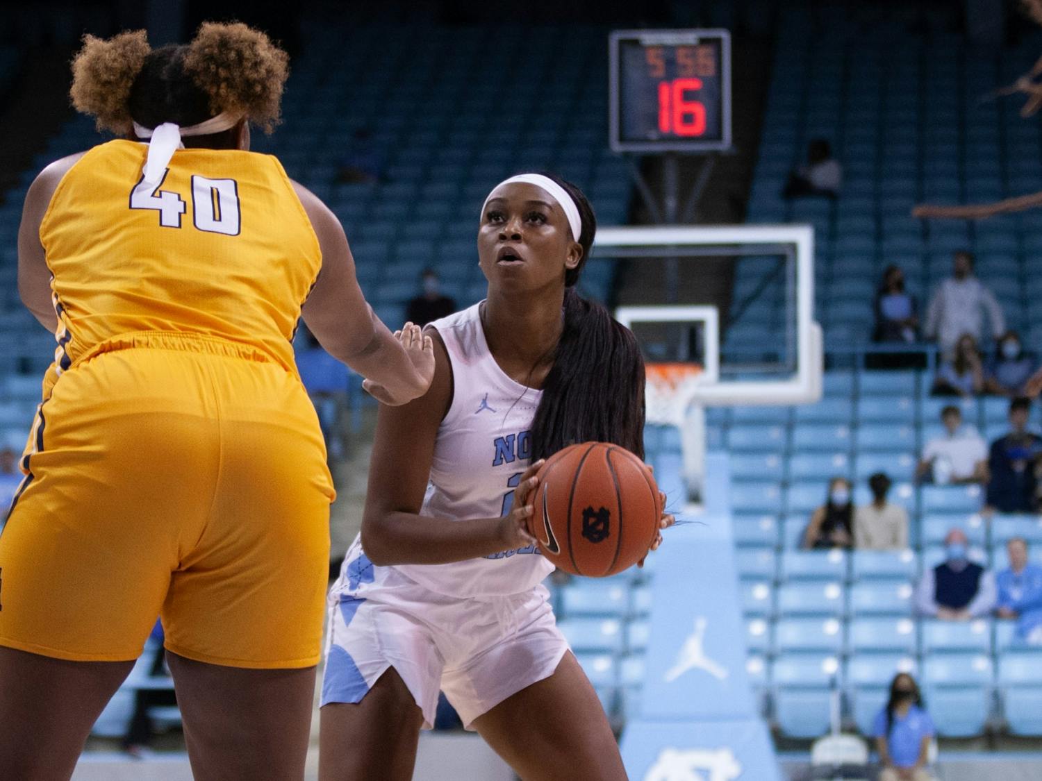 Junior forward Malu Tshitenge (21) prepares to shoot the ball at the women's basketball game against NC A&T on Nov. 9 at Carmichael Arena. UNC won 92-47.