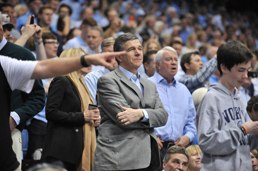 <p>N.C. Governor Roy Cooper looks on at the UNC-Duke game.&nbsp;</p>