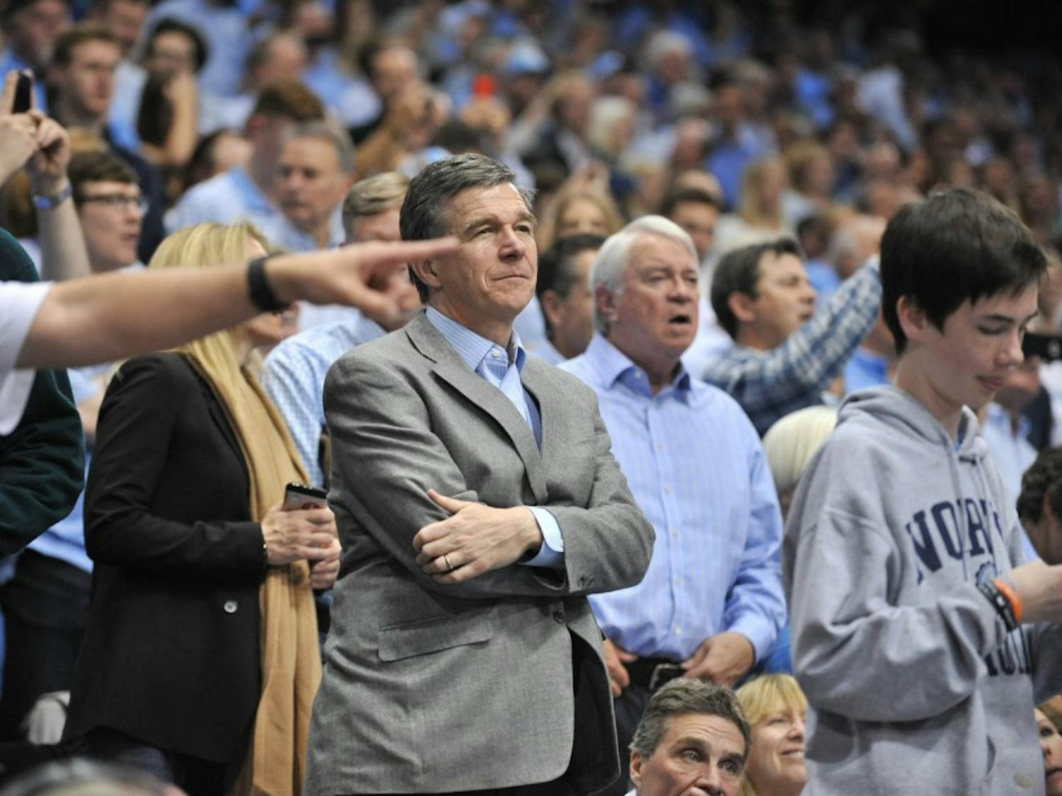 N.C. Governor Roy Cooper looks on at the UNC-Duke game.&nbsp;