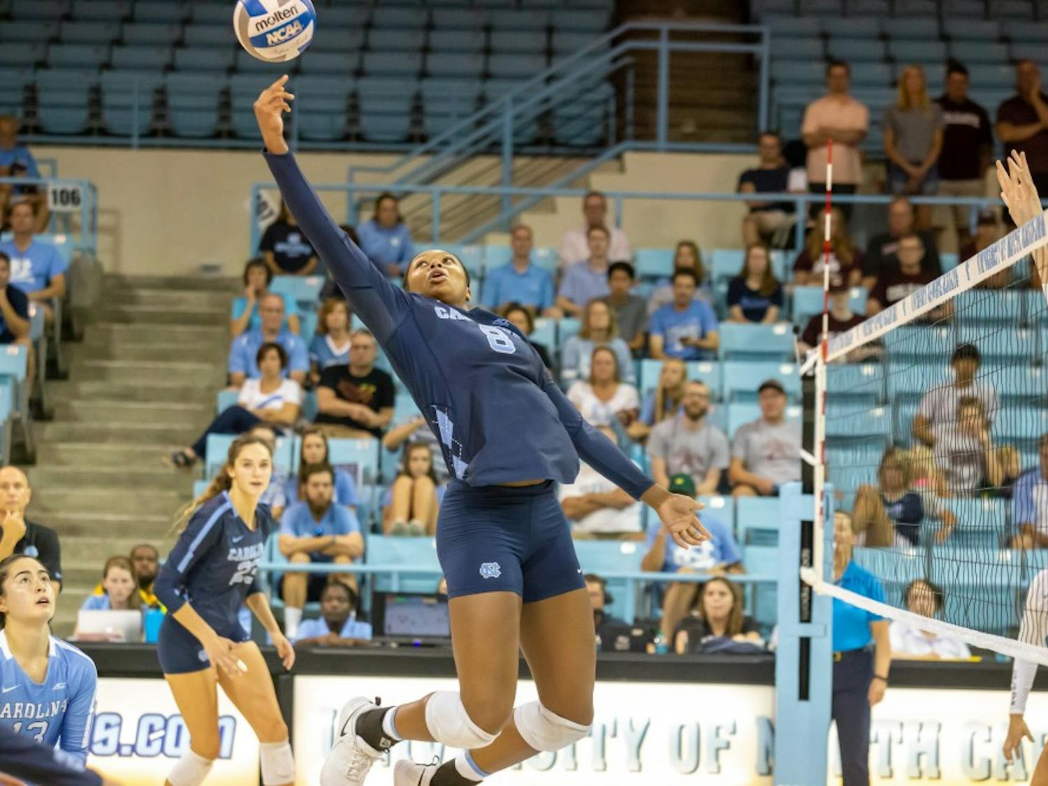 UNC freshman middle blocker Skyy Howard (8) spikes the ball during the Tar Heels' 3-1 win against the Colgate Raiders on Saturday, Sept. 21, 2019 in Carmichael Arena in Chapel Hill.