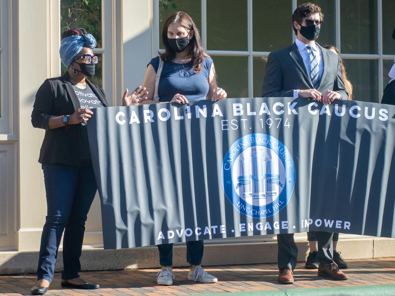 Members of the Carolina Black Caucus stand outside of the Carolina Inn to protest the UNC decision to deny tenure to Nikole Hannah-Jones on Thursday May 20, 2021 before the UNC Board of Trustees meeting.
