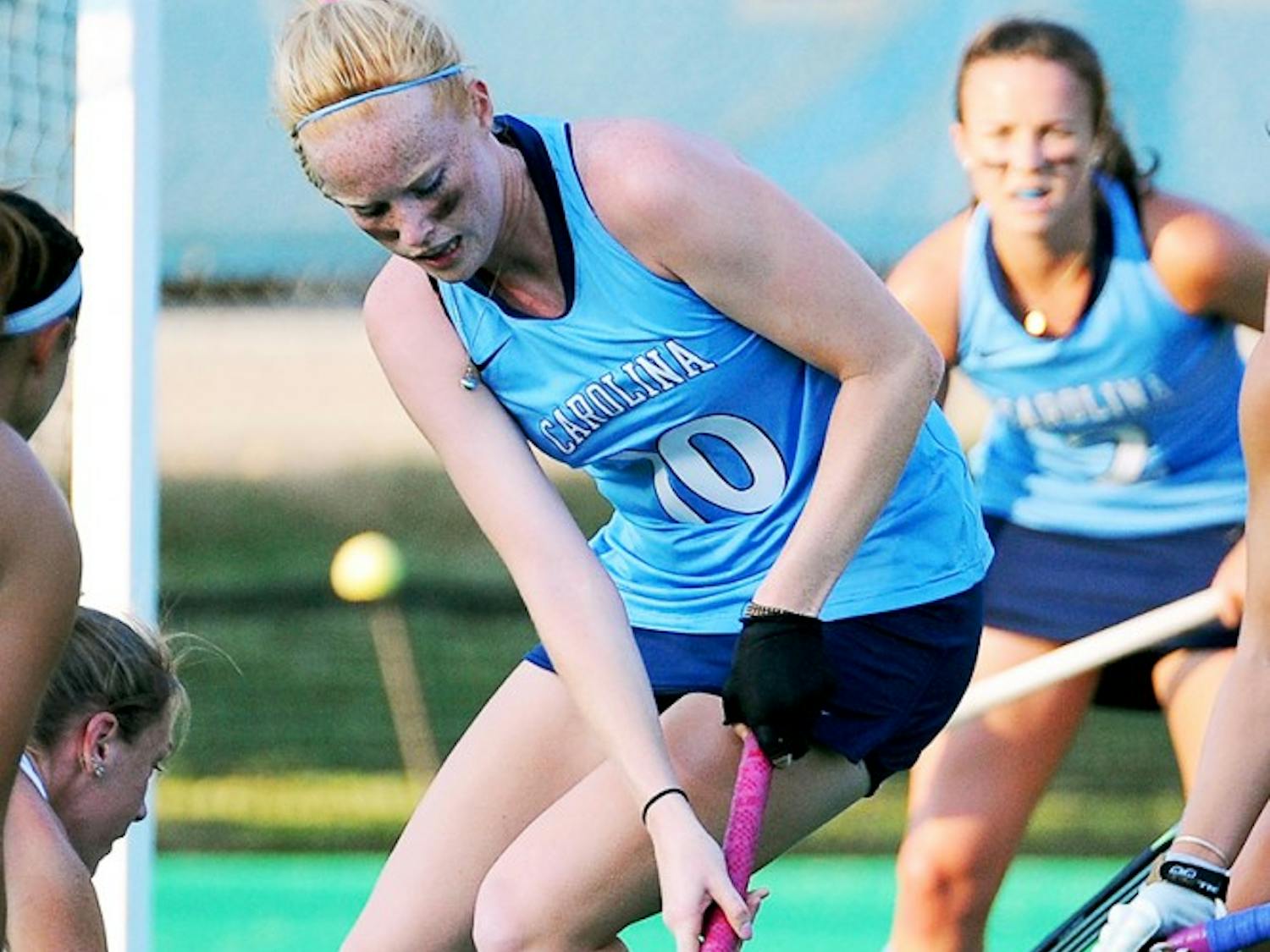 UNC back Nina Notman (10) protects the ball in the offensive zone.