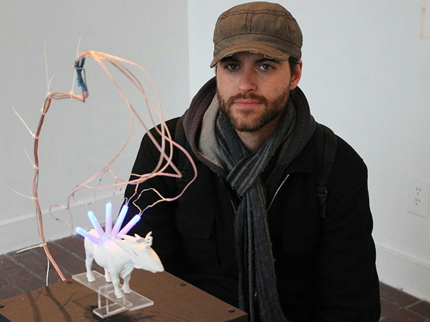 Lile Stephens is a MFA student at UNC-CH. His MFA thesis exhibition  "Operating Systems" is on display from February 10 - 14. There will be a reception, February 13, at 6pm for his exhibit. Stephens's favorite piece in his exhibit was his cow statue.