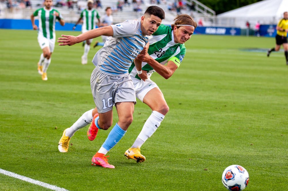 UNC senior forward Giovanni Montesdeoca (10) chases the ball during the semifinals of the College Cup against Marshall at the WakeMed Soccer Park in Cary, NC on Friday May 14, 2021. The Tar Heels lost 1-0.