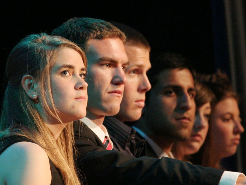 The Cooper administration listens attentively to the various speeches given at Inauguration Tuesday in the Great Hall.