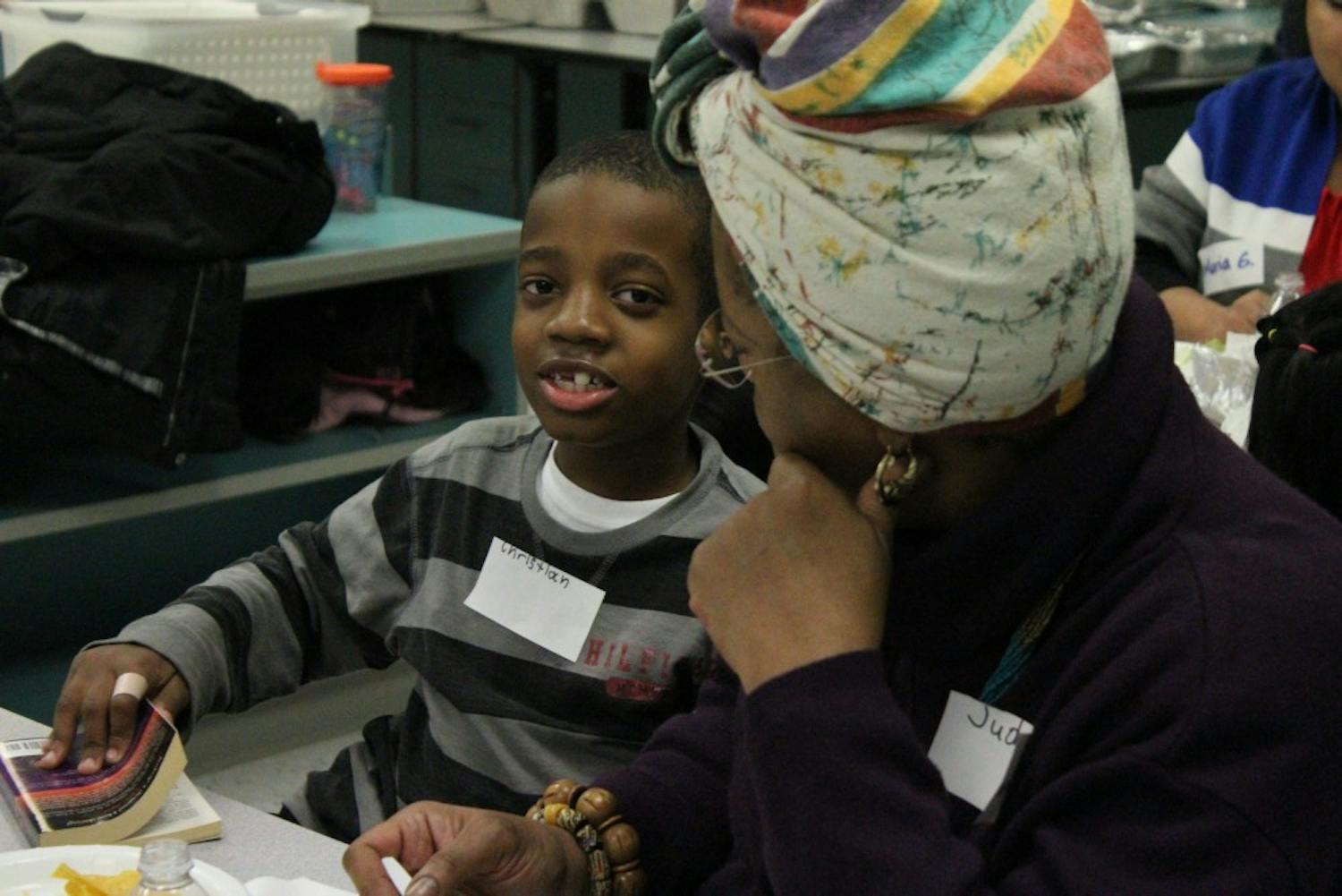 Christian and his mom talk get ready to read during McDougle Elementary School's first Family Reading Partners program event.