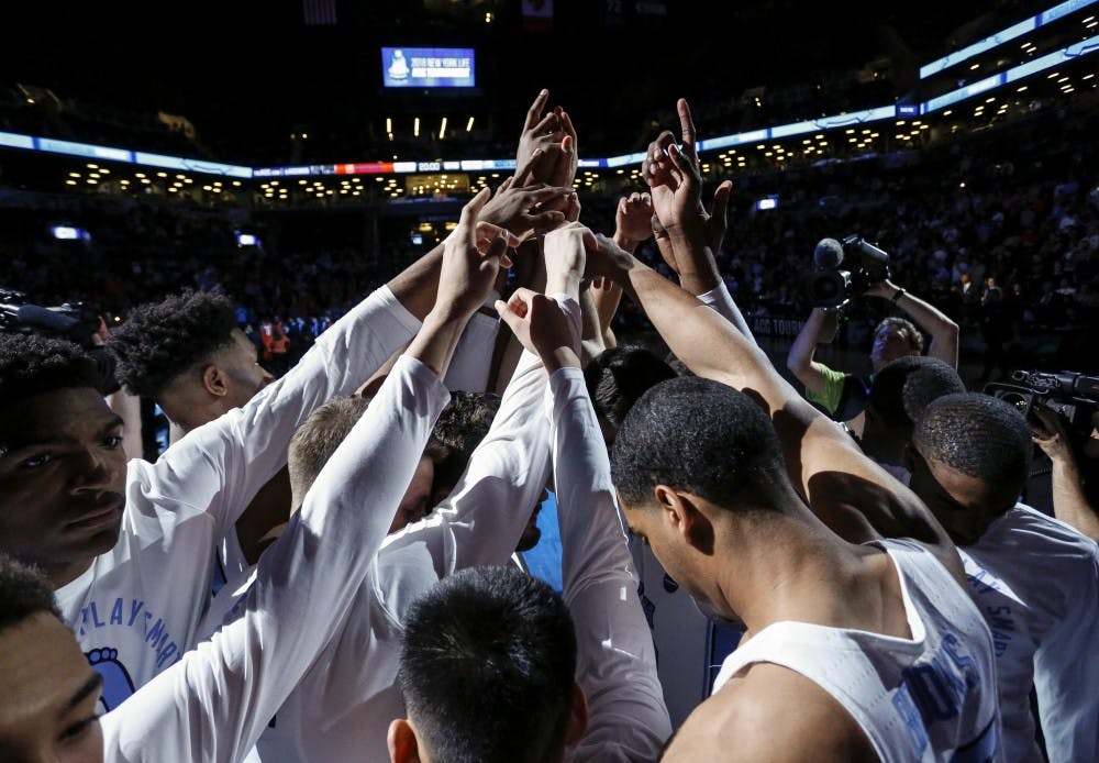 <p>The North Carolina men's basketball team huddles before its ACC Tournament game against Syracuse on Wednesday night in Brooklyn, New York. Photo courtesy of David Welker, theACC.com</p>