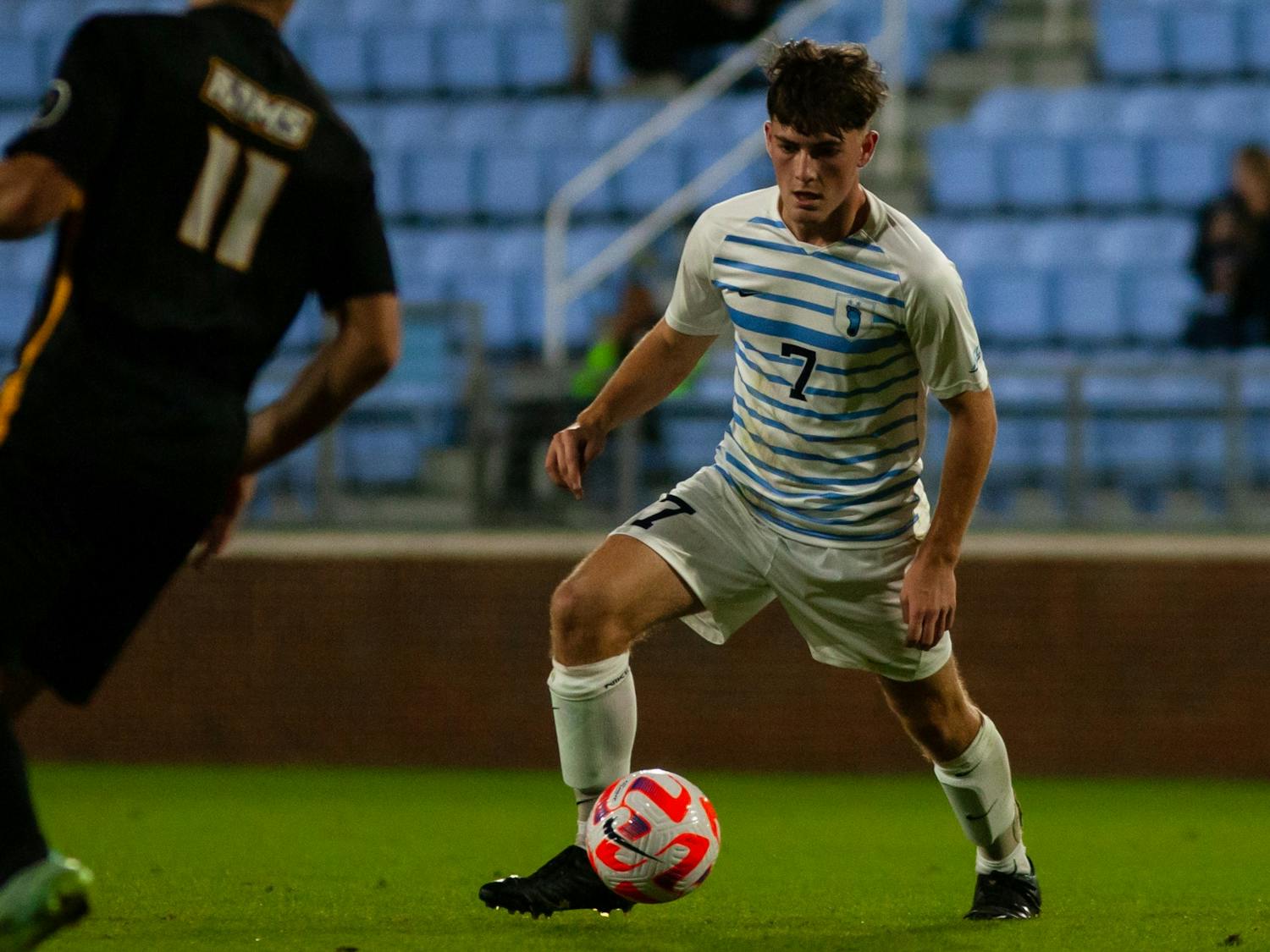 UNC first-year midfielder Sam Williams (7) defends the ball during UNC's 1-0 victory against VCU on Tuesday, Oct. 11, 2022, at Dorrance Field.