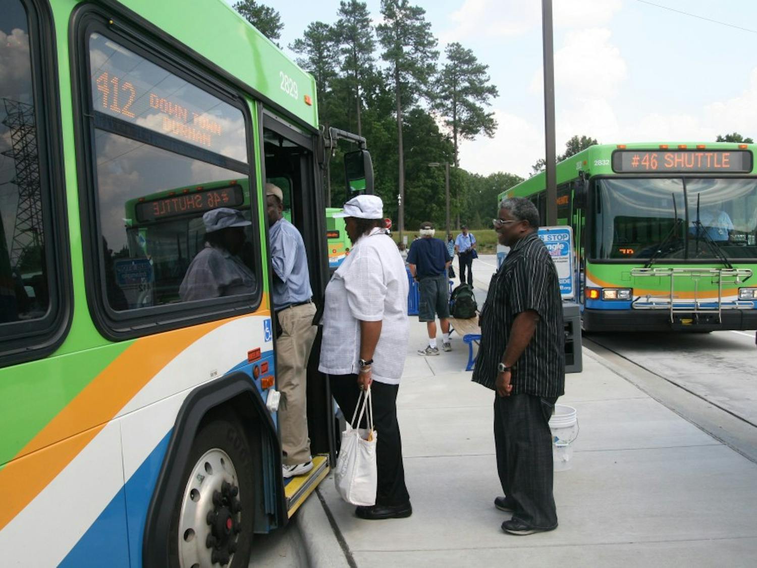 Residents board a GoTriangle bus going to downtown Durham. GoTriangle and the Durham-Chapel Hill-Carrboro Metropolitan Planning Organization (DCHC-MPO) are planning on applying for $1 billion of federal funding for a light rail once designs for the project are completed. Photo by Amanda Nappi.&nbsp;