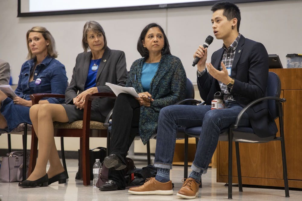 Chapel Hill Town Council candidate Tai Huynh (far right) speaks at the UNC Young Democrats' Local Candidates Panel in Manning Hall on Tuesday, Oct. 8, 2019. Also pictured are council candidates Jessica Anderson (far left), Nancy Oates (center left), and Renuka Soll (center right). 
