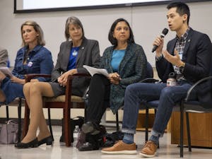 Chapel Hill Town Council candidate Tai Huynh (far right) speaks at the UNC Young Democrats' Local Candidates Panel in Manning Hall on Tuesday, Oct. 8, 2019. Also pictured are council candidates Jessica Anderson (far left), Nancy Oates (center left), and Renuka Soll (center right). 

