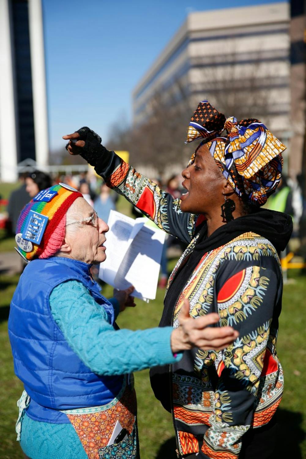 Two women at the 2019 Raleigh Women’s March converse about the role of diversity in women’s rights movements on Halifax Mall Saturday, Jan. 26, 2019.