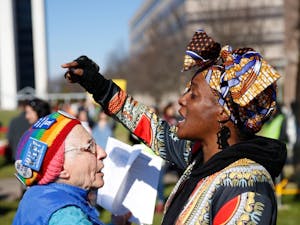 Two women at the 2019 Raleigh Women’s March converse about the role of diversity in women’s rights movements on Halifax Mall Saturday, Jan. 26, 2019.
