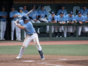 First-year catcher Eric Grintz prepares to swing for his fourth hit of the game, a 2-run double in the 8th inning of the Diamond Heels' 7-1 win over Elon Tuesday, Feb.18, 2020.