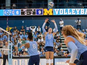 UNC sophomore setter Anita Babic (12) hits the ball during volleyball match against Michigan on Saturday, Sept. 10, 2022, at Carmichael Arena. Michigan beat UNC 3-0.