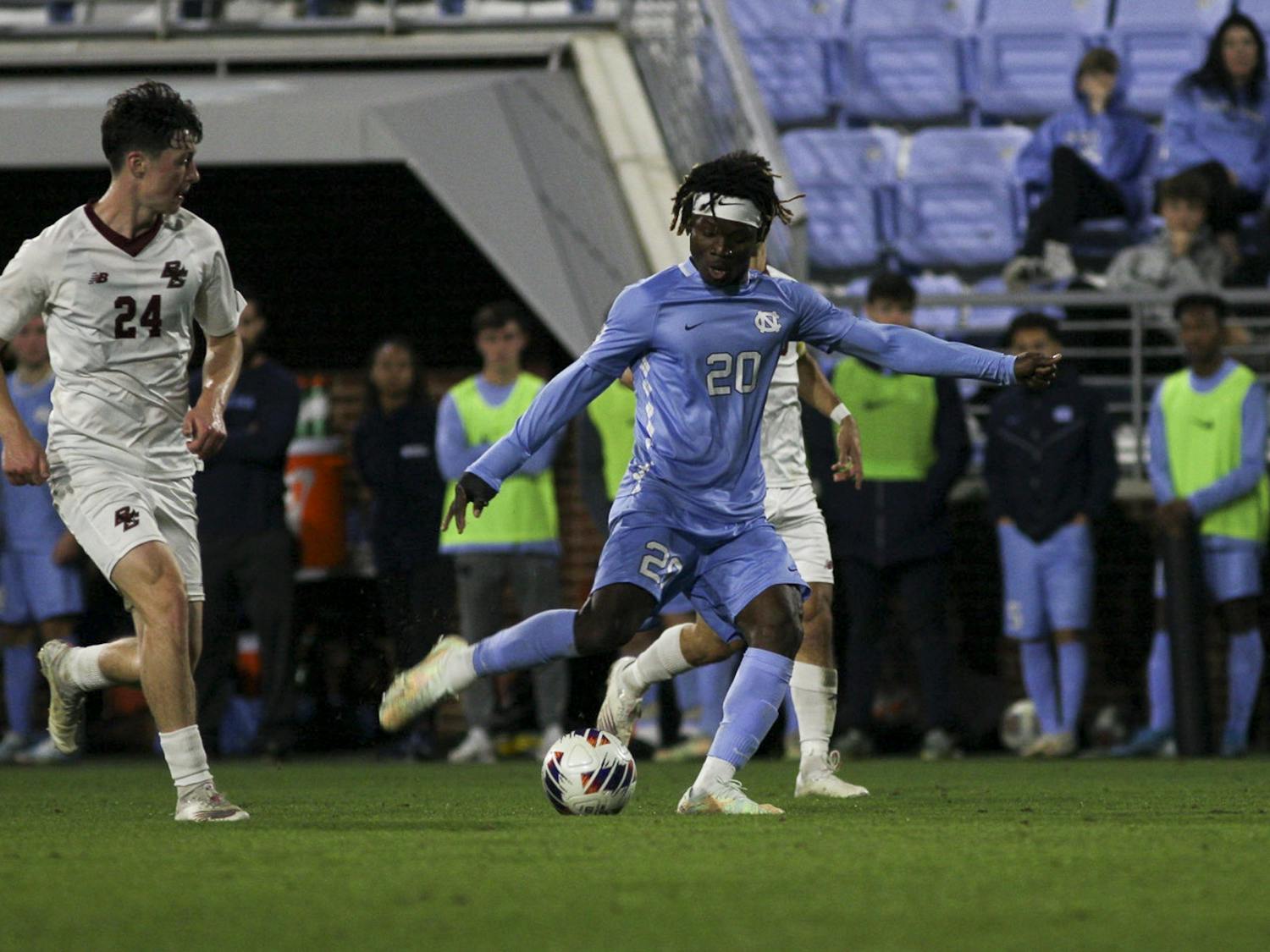 UNC junior midfielder/forward Ernest Bawa (20) kicks the ball during the game against Boston College at Dorrance Field on Wednesday, Nov. 2, 2022. UNC beat Boston College 1-0.