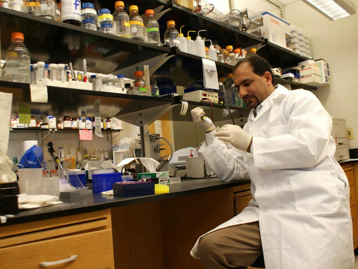 Manzoor Bhat works in his lab in the Neuroscience Center in 2011.