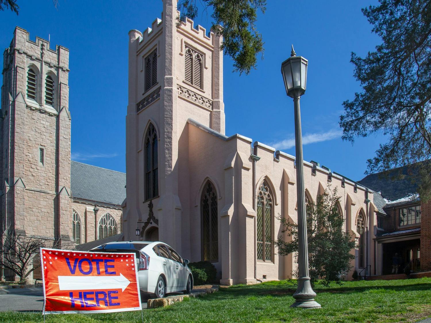 A sign directs voters to Chapel of the Cross where primary early voting is held on Sunday, Feb. 23, 2020.